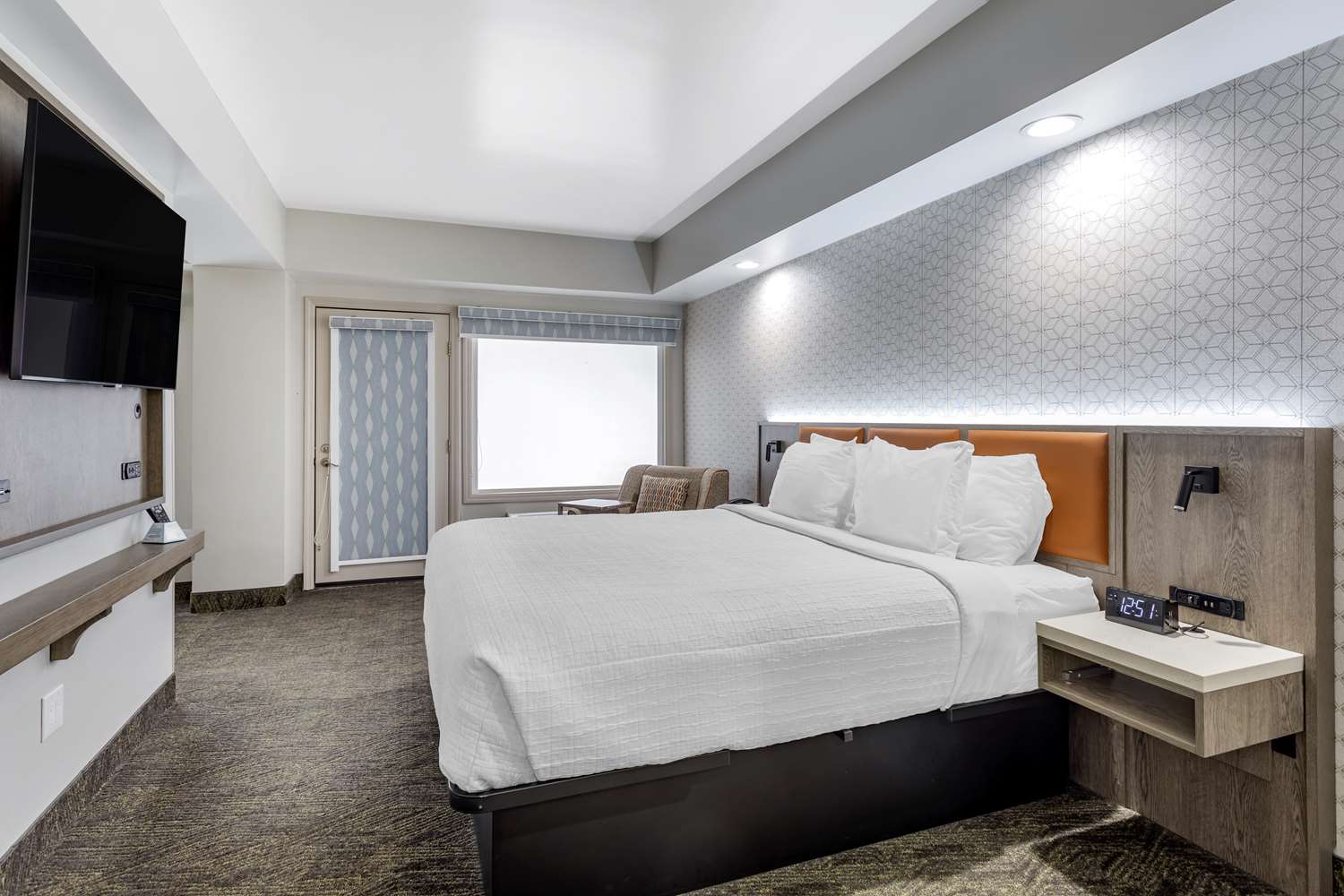 King bed area with balcony access