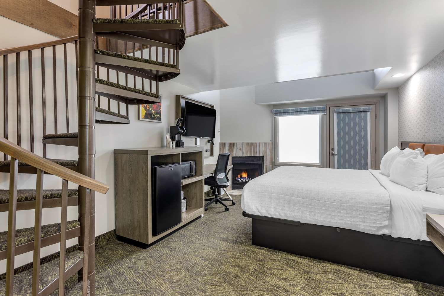 King Queen Loft Suite with king bed downstairs and queen bed in loft